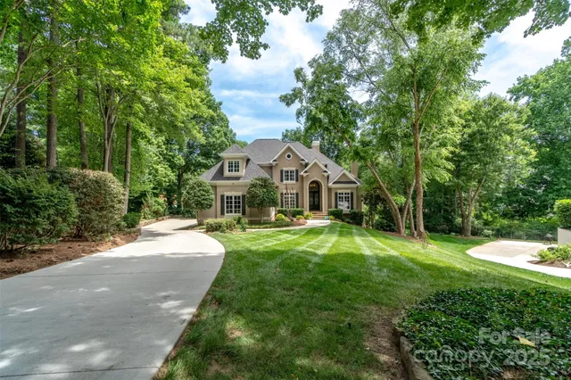 a front view of a house with yard patio and green space