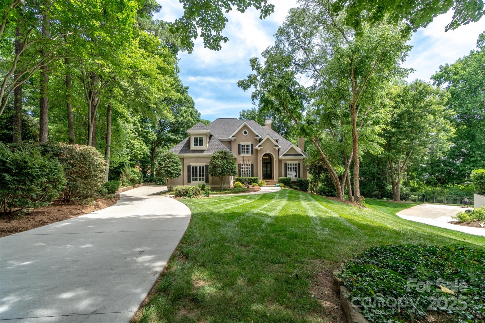 19002 Meta Road Cornelius, NC 28031 - Photo 2 of 48 a front view of a house with yard patio and green space