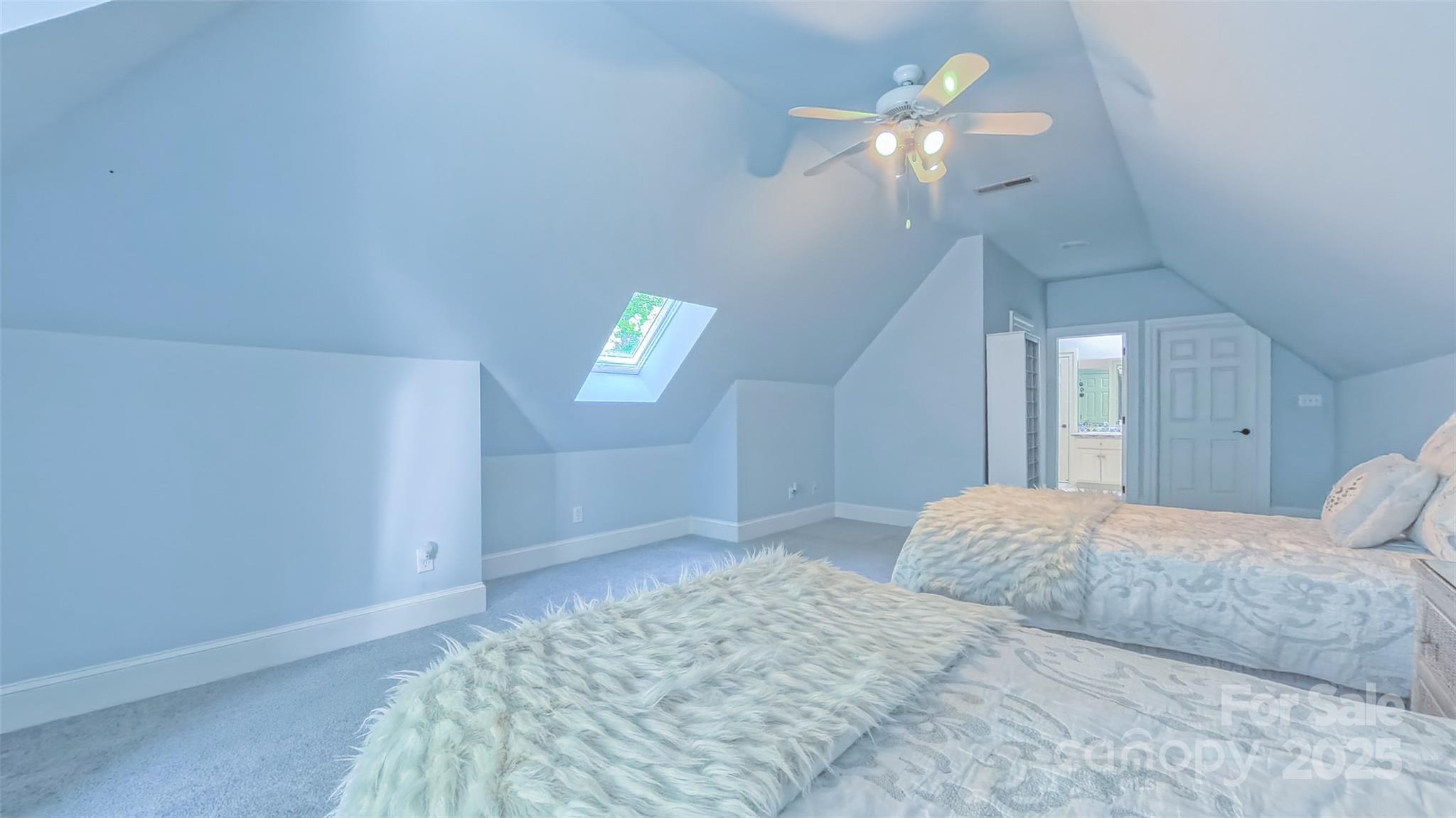 19002 Meta Road Cornelius, NC 28031 - Photo 29 of 48 a bedroom with a large bed and a chandelier