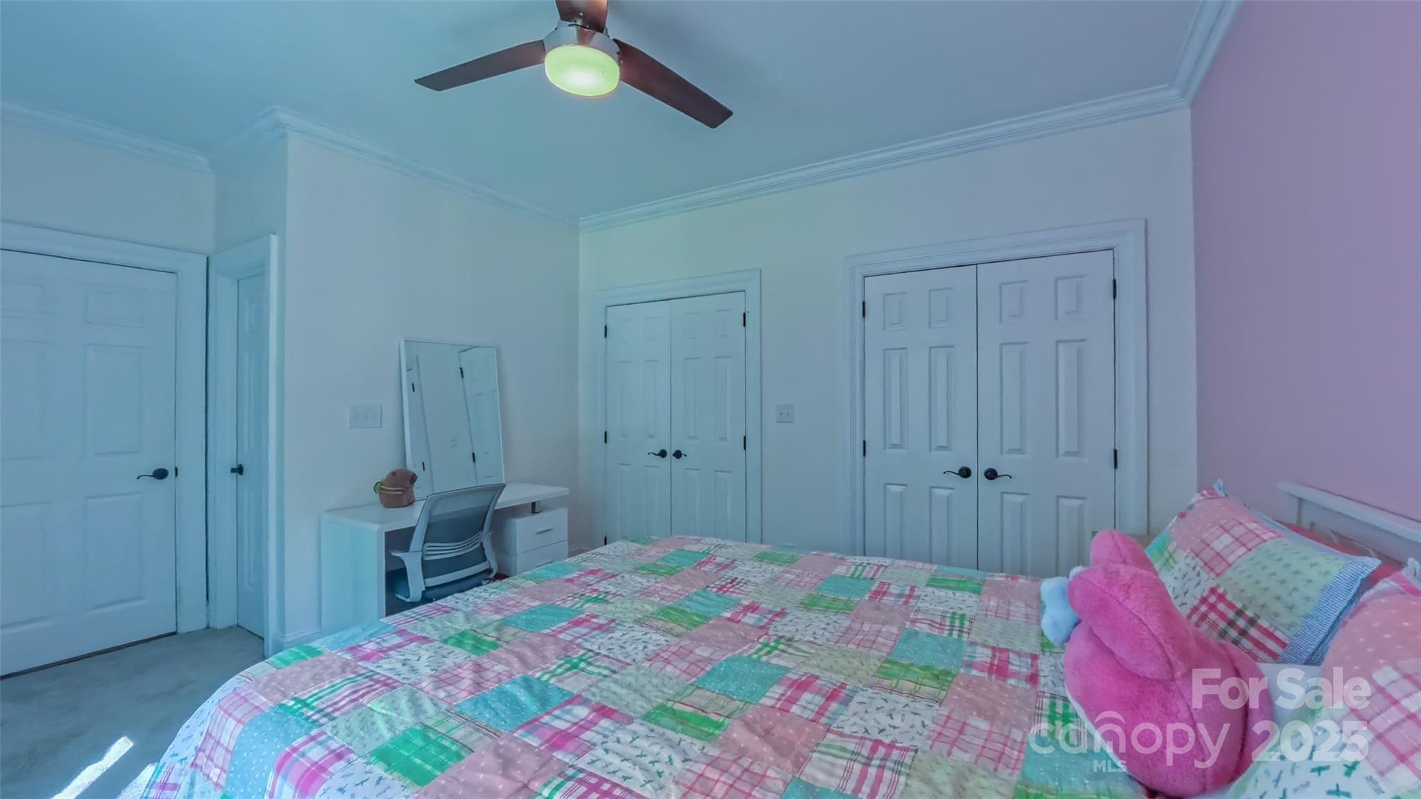 19002 Meta Road Cornelius, NC 28031 - Photo 30 of 48 a bedroom with a bed and a chandelier