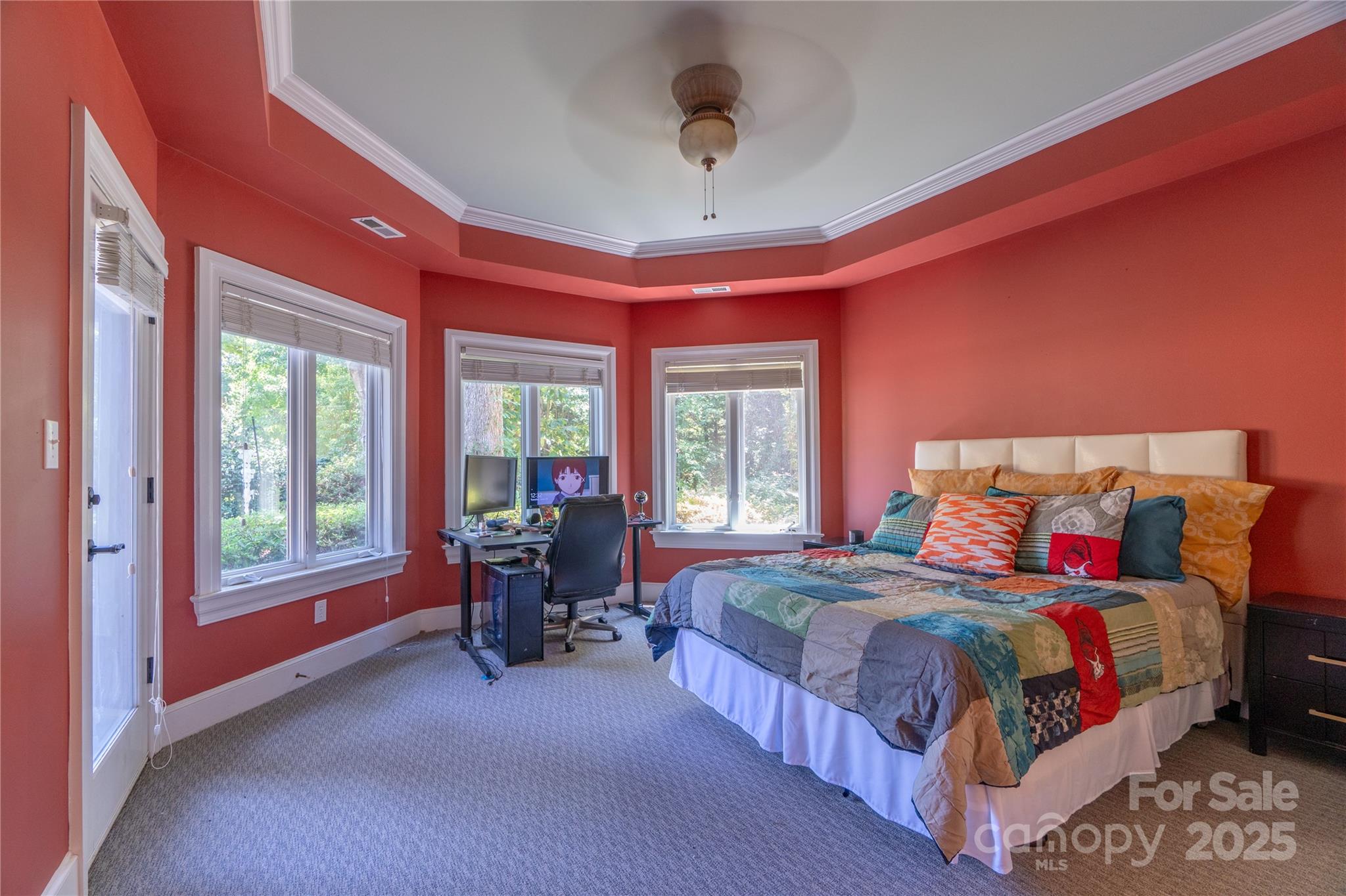 19002 Meta Road Cornelius, NC 28031 - Photo 32 of 48 a bedroom with a bed and large windows