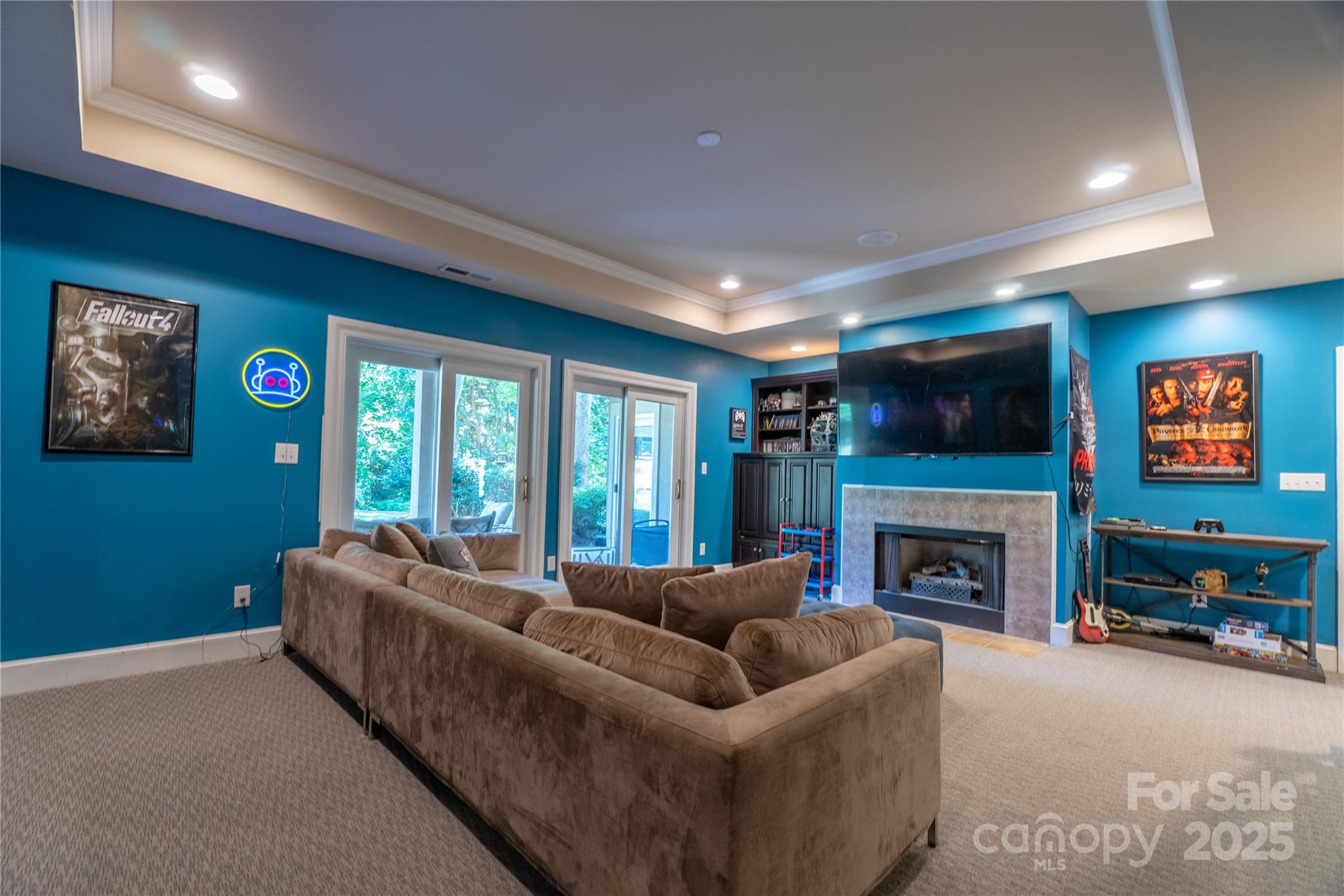 19002 Meta Road Cornelius, NC 28031 - Photo 35 of 48 a living room with furniture a flat screen tv and a fireplace