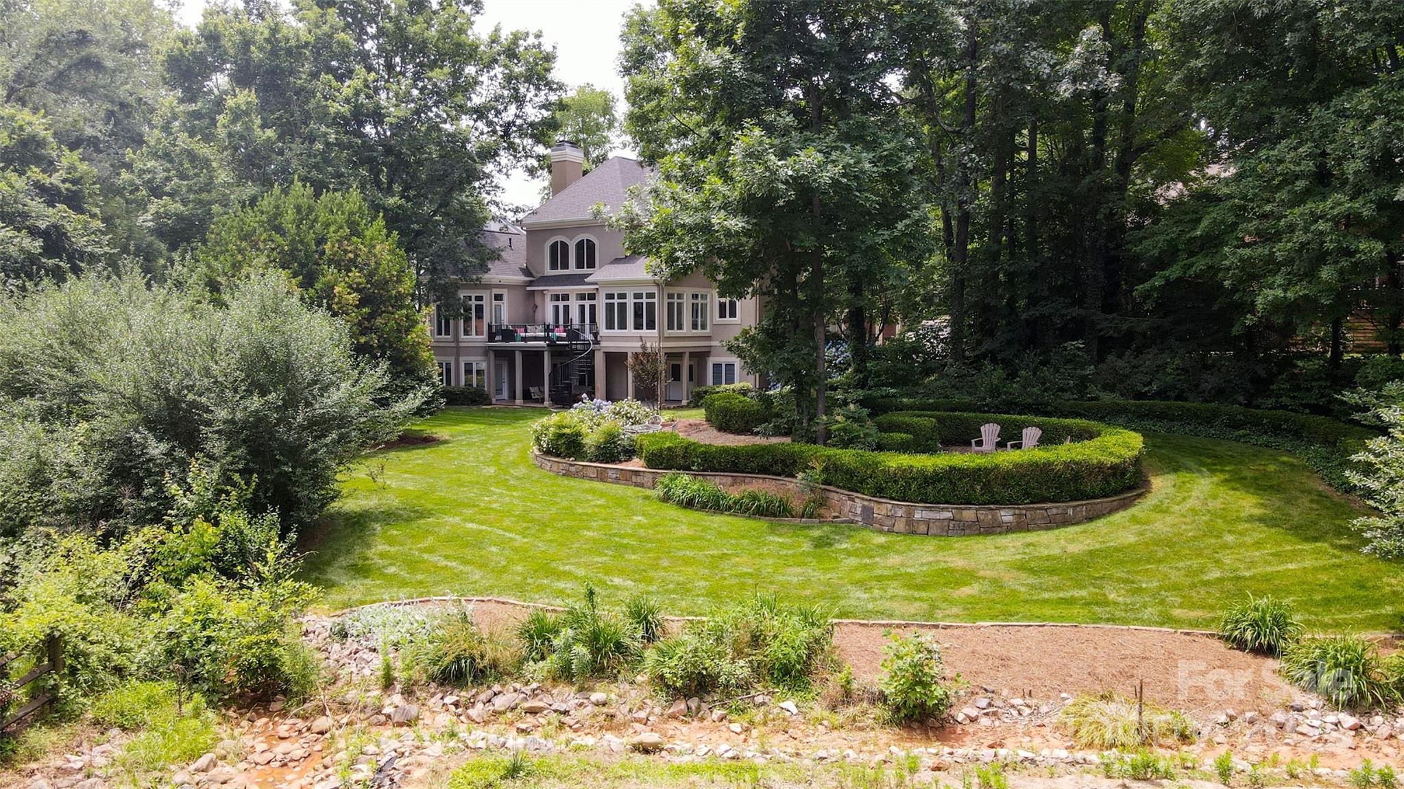 19002 Meta Road Cornelius, NC 28031 - Photo 42 of 48 a view of a house with swimming pool and sitting area