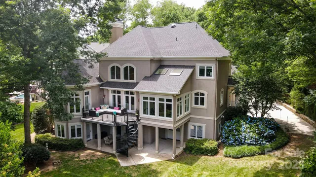 a aerial view of a house yard and swimming pool