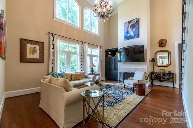 a living room with fireplace furniture and a flat screen tv