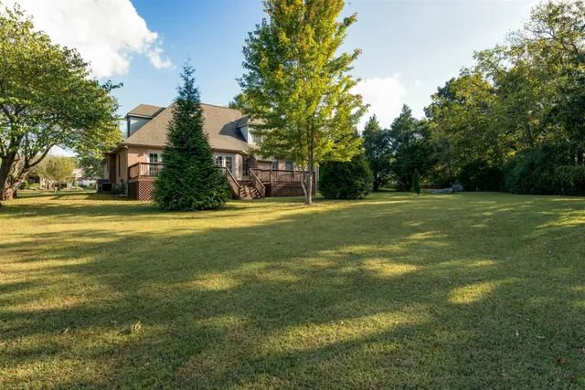 a view of a house with a big yard