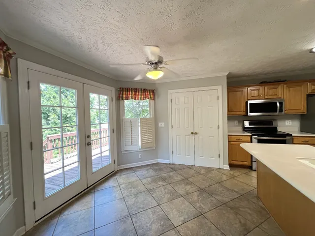 a kitchen with a stove a sink and a refrigerator