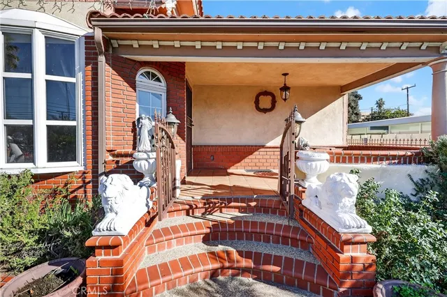 a front view of a house with a large window