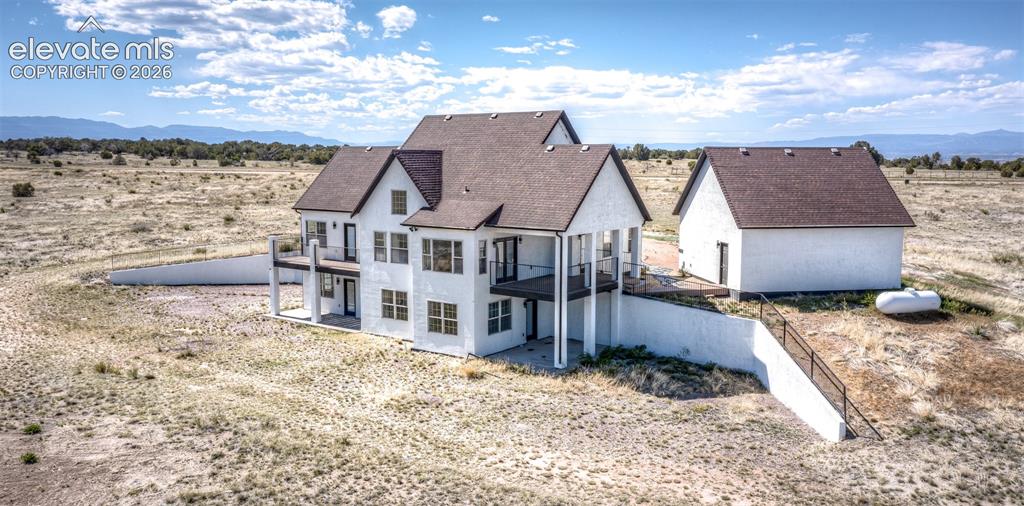 1120 Newton Road Pueblo, CO 81005 - Photo 40 of 46 a view of a house with a yard