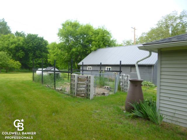 7672 Kitchen Road Goodells, MI 48027 - Photo 30 of 44 fenced dog area