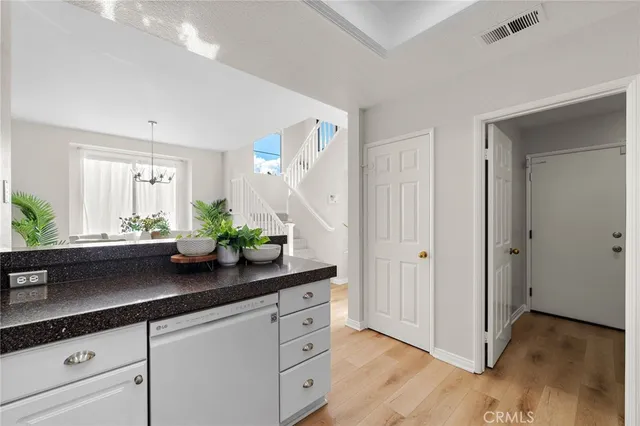 a kitchen with stainless steel appliances and counter space