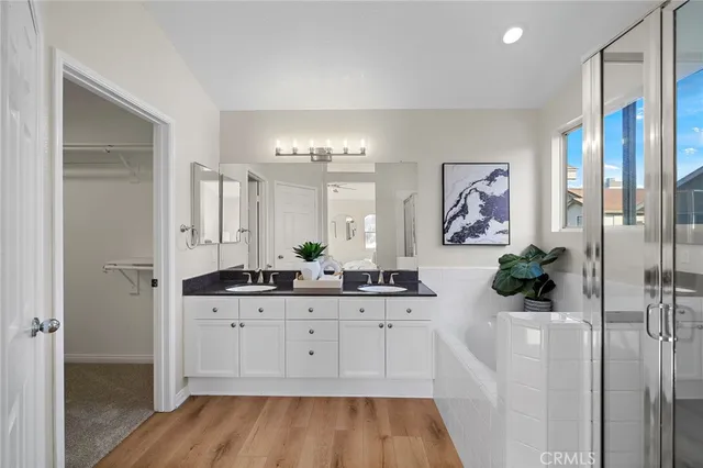 a view of bathroom with mirror and sink