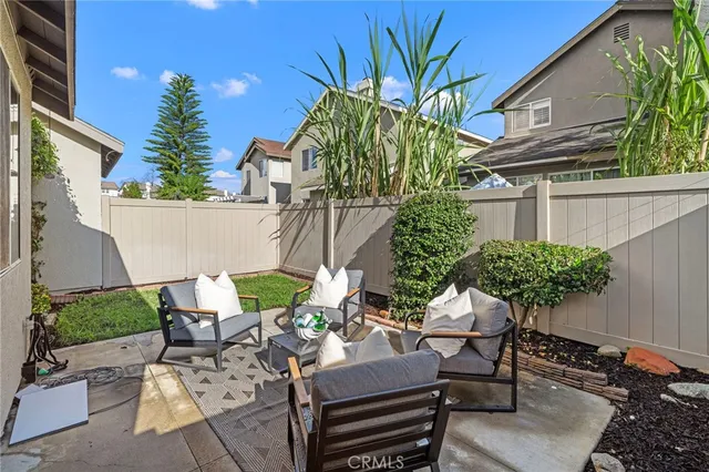 a view of a chairs and table in a patio