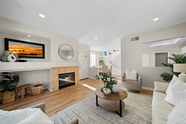 a living room with furniture fireplace and flat screen tv