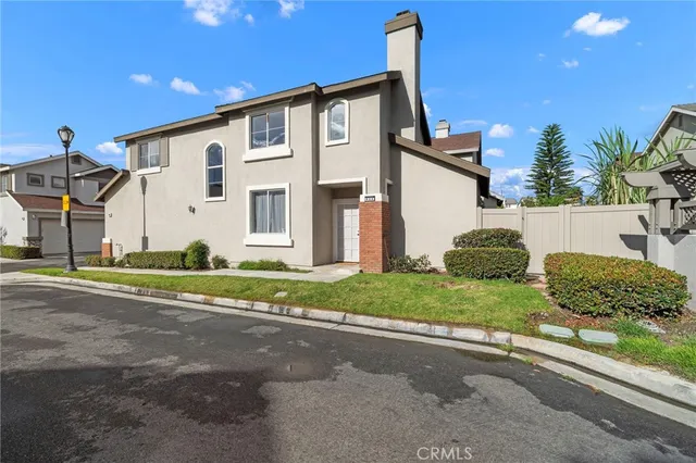 an aerial view of a house with garden space and street view