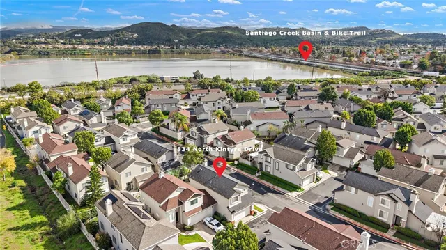 an aerial view of a houses with a city street