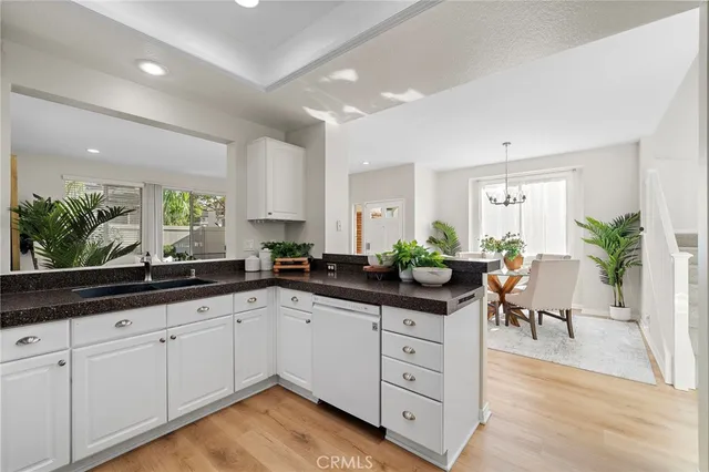 a kitchen with sink and cabinets