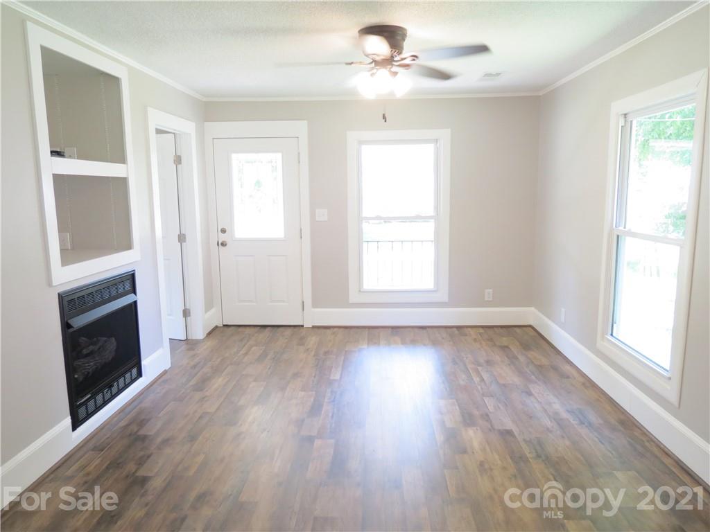 431 Union Cemetery Road Southwest Concord, NC 28027 - Photo 12 of 38 wooden floor in an empty room with a window
