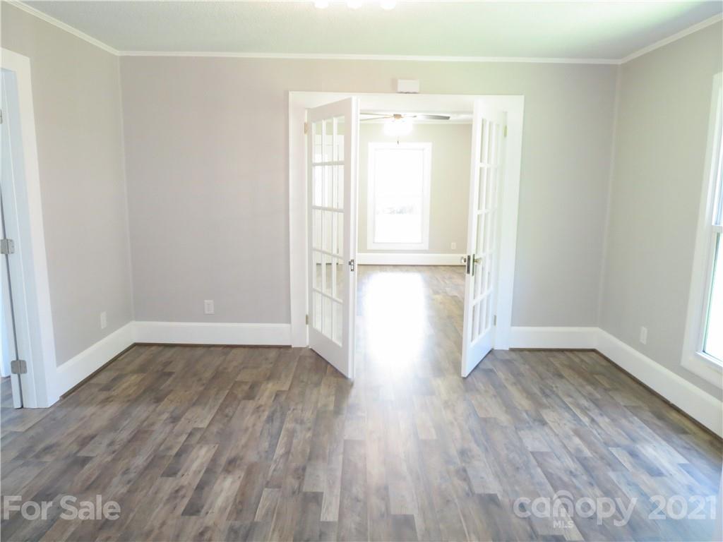 431 Union Cemetery Road Southwest Concord, NC 28027 - Photo 17 of 38 a view of empty room with wooden floor