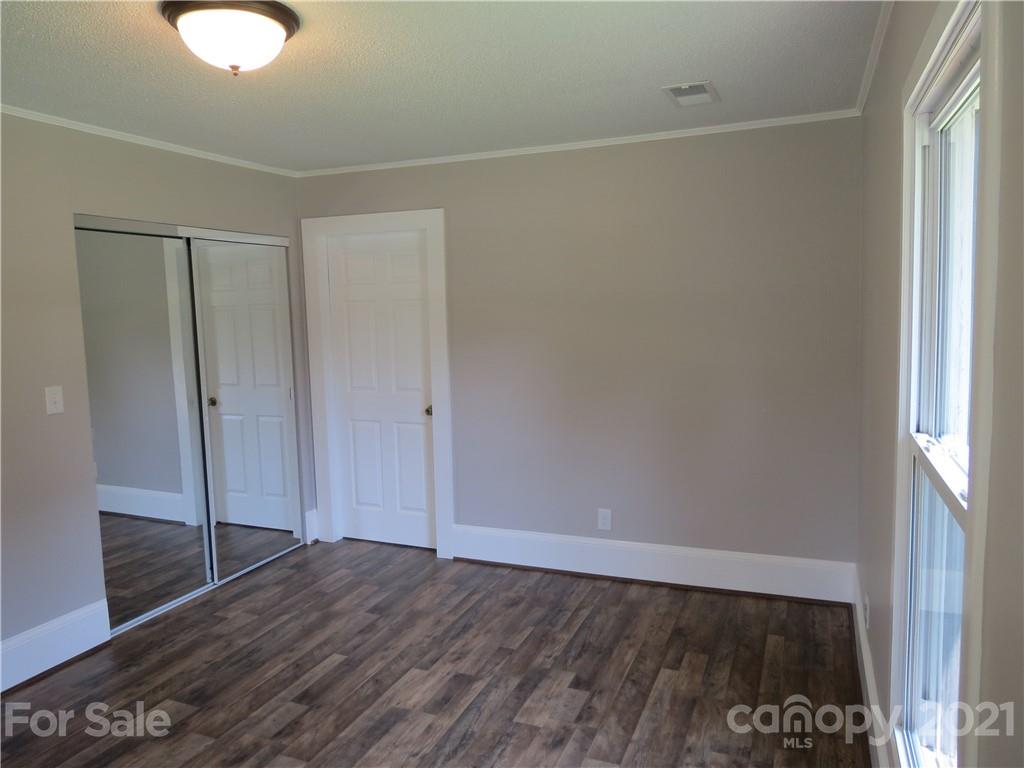 431 Union Cemetery Road Southwest Concord, NC 28027 - Photo 25 of 38 a view of an empty room with wooden floor