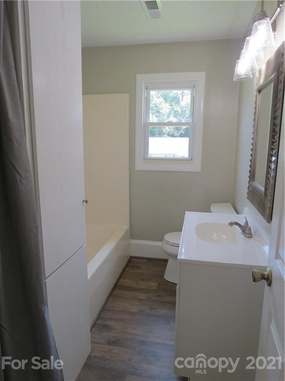 431 Union Cemetery Road Southwest Concord, NC 28027 - Photo 27 of 38 a en suite bathroom with a sink and a mirror