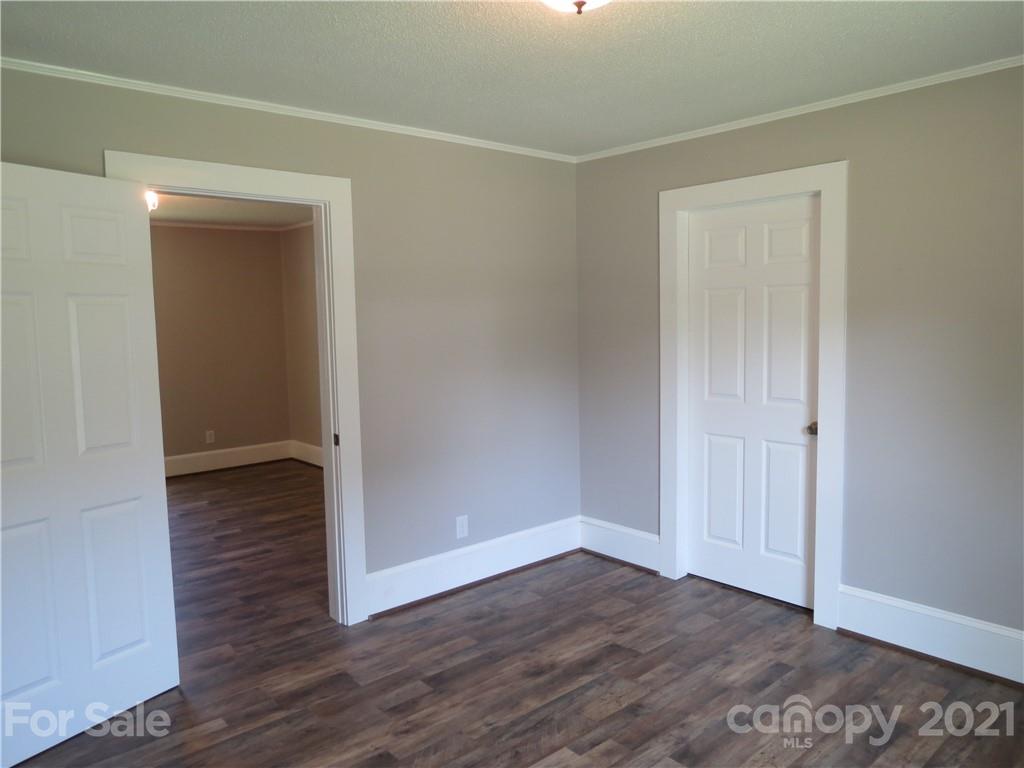 431 Union Cemetery Road Southwest Concord, NC 28027 - Photo 29 of 38 a view of a room with wooden floor and closet