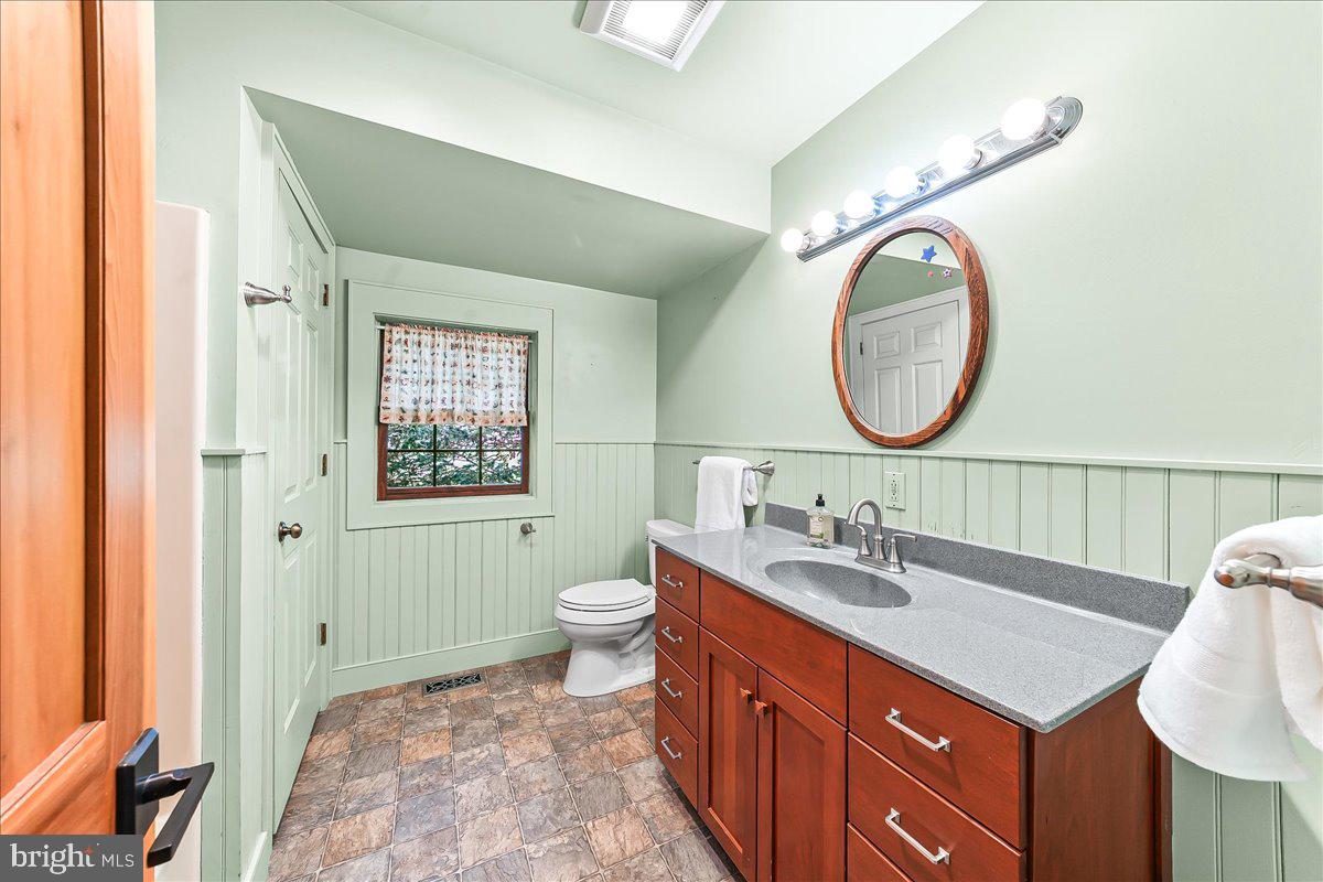 202 Creek Road Lincoln University, PA 19352 - Photo 19 of 36 a bathroom with a sink vanity mirror and toilet