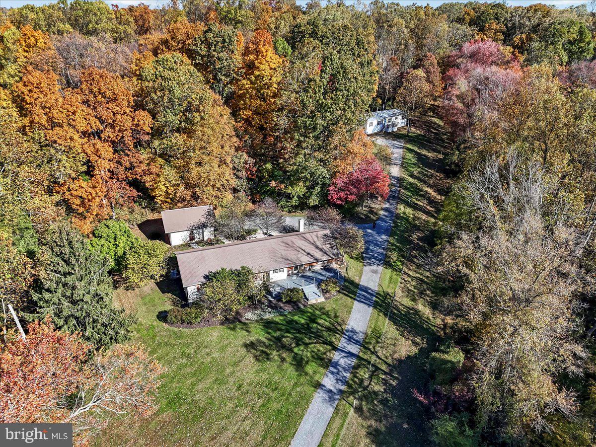 202 Creek Road Lincoln University, PA 19352 - Photo 2 of 36 an aerial view of residential house with outdoor space and trees all around