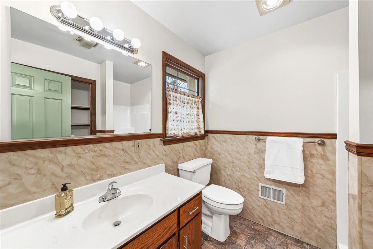 202 Creek Road Lincoln University, PA 19352 - Photo 20 of 36 a bathroom with a sink a toilet and mirror