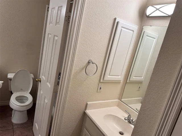 a bathroom with a toilet and a sink