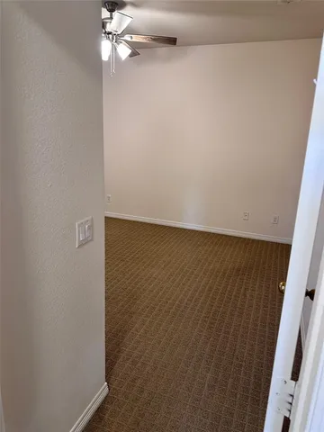 en empty room with wooden floor