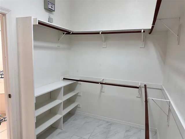 a view of an empty walk in closet