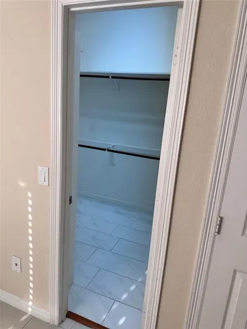 a bathroom with a glass door shower