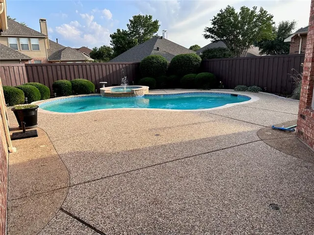a view of a house with backyard porch and sitting area