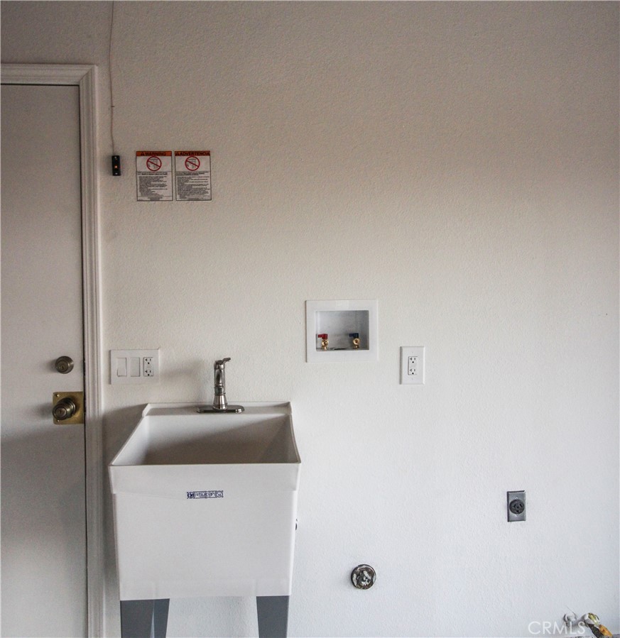 6736 Summit Valley Road Hesperia, CA 92345 - Photo 19 of 24 a bathroom with a sink a mirror and shower