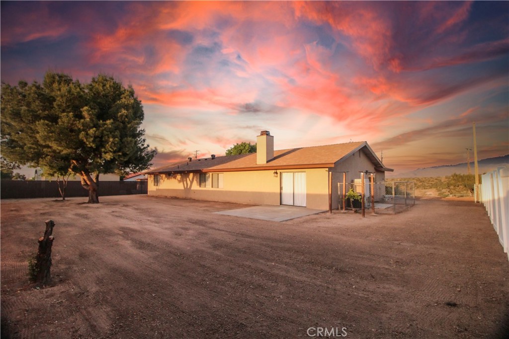 6736 Summit Valley Road Hesperia, CA 92345 - Photo 21 of 24 a view of a house with a yard