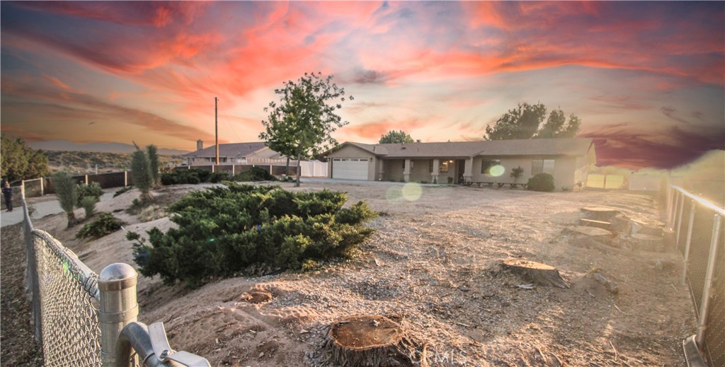 6736 Summit Valley Road Hesperia, CA 92345 - Photo 22 of 24 a view of a house with a yard