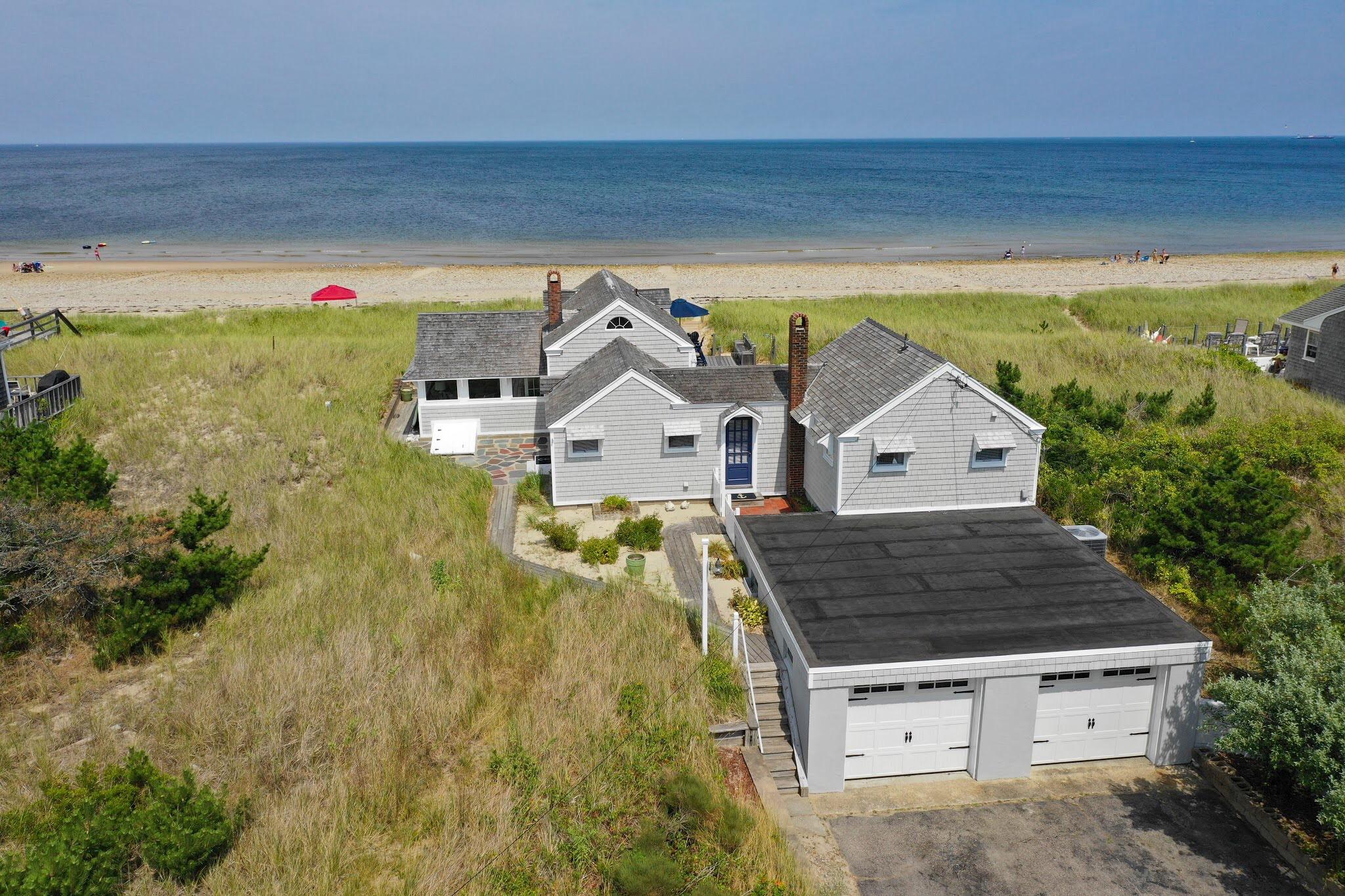a aerial view of a house with a yard