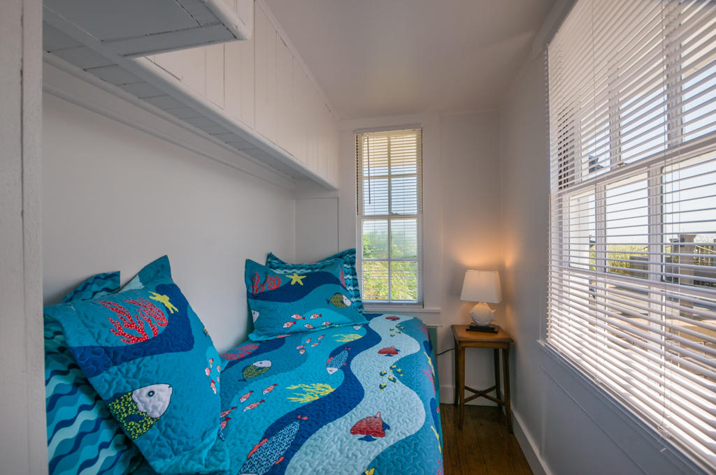 217 Phillips Road Sandwich, MA 02562 - Photo 18 of 37 a bedroom with two beds and a large window