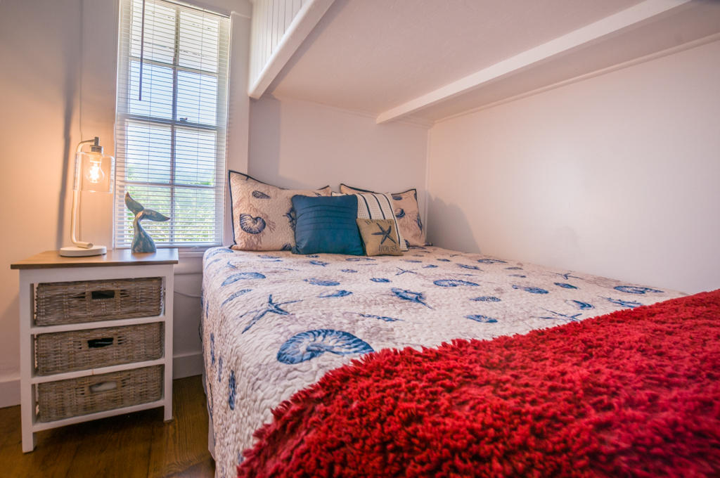 217 Phillips Road Sandwich, MA 02562 - Photo 19 of 37 a bedroom with a bed and a window