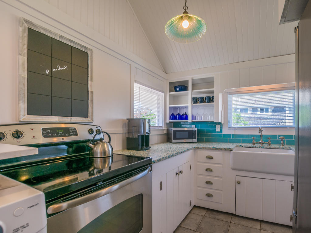 217 Phillips Road Sandwich, MA 02562 - Photo 21 of 37 a kitchen with kitchen island granite countertop a stove and a sink