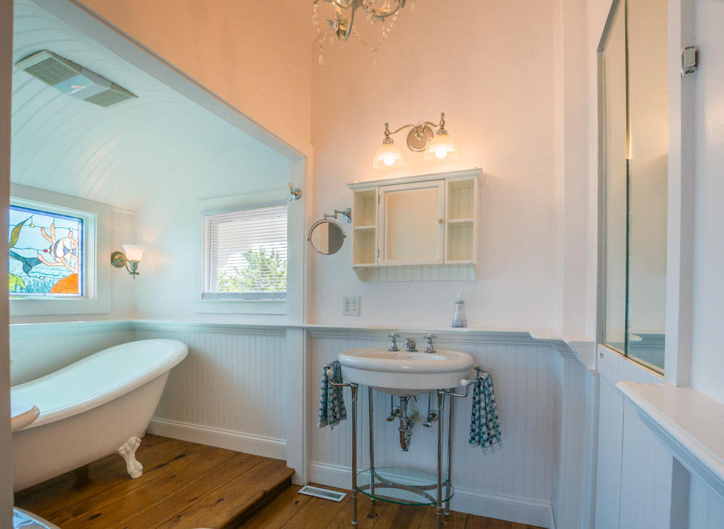 217 Phillips Road Sandwich, MA 02562 - Photo 28 of 37 a bathroom with a sink toilet a mirror and a window