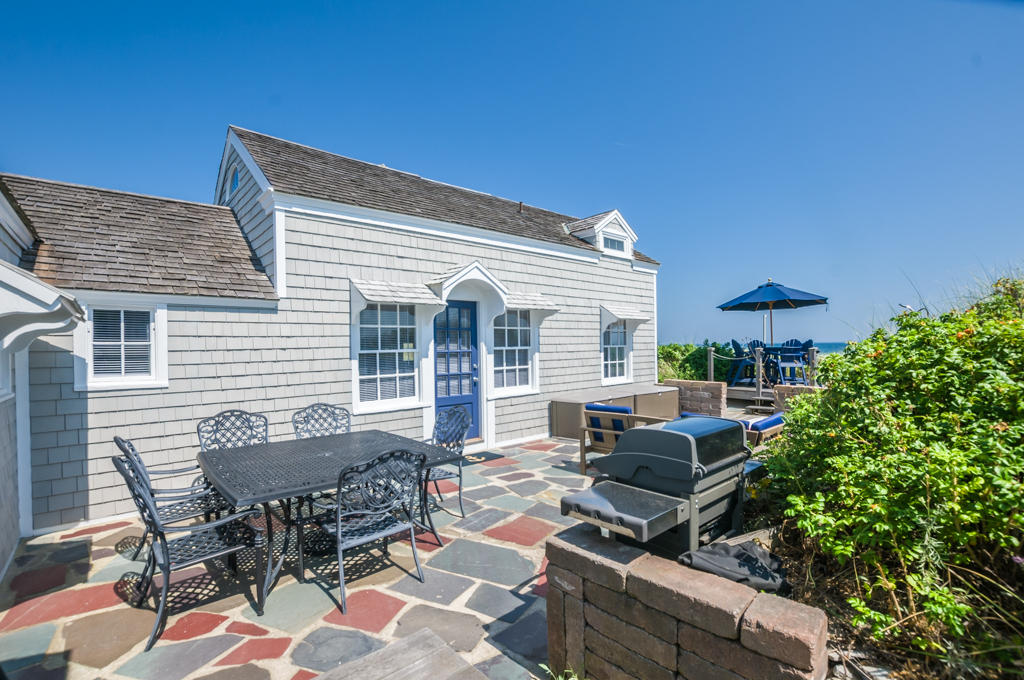 217 Phillips Road Sandwich, MA 02562 - Photo 4 of 37 a backyard of a house with table and chairs