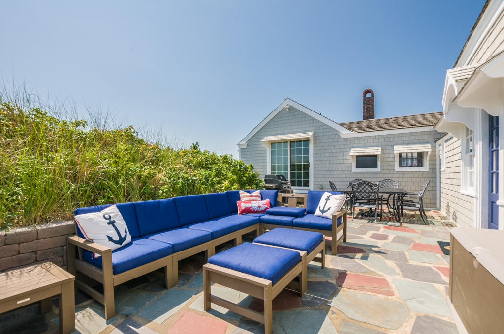217 Phillips Road Sandwich, MA 02562 - Photo 5 of 37 a outdoor living space with furniture and a potted plant