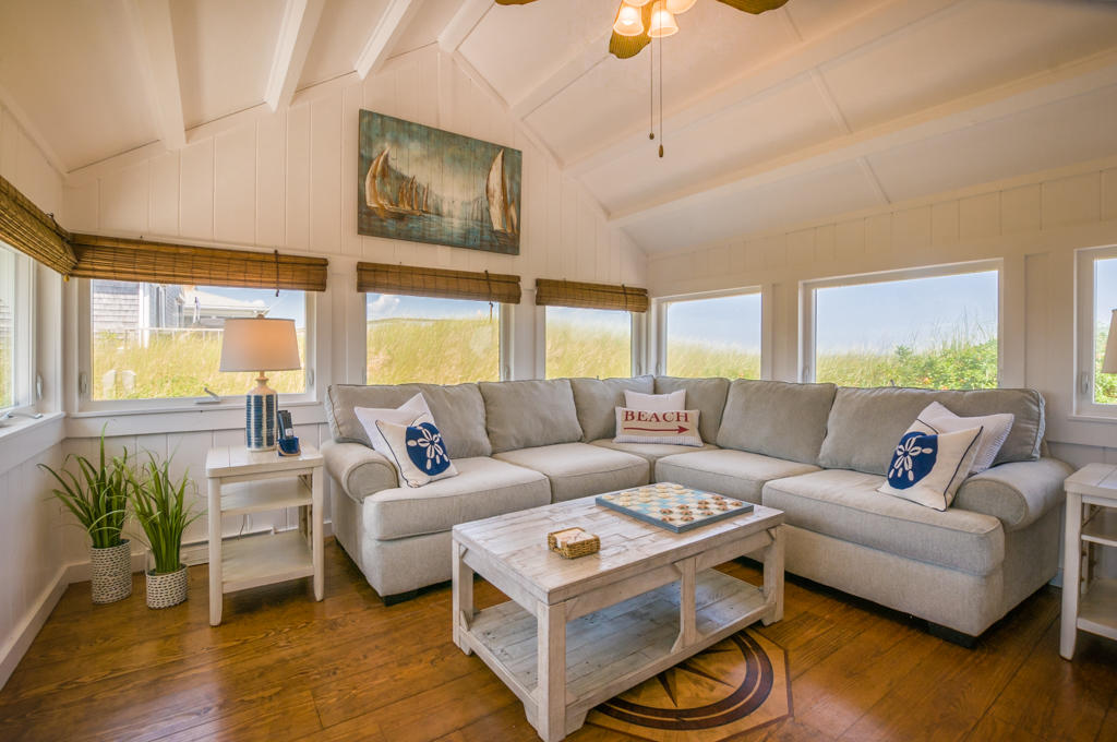 217 Phillips Road Sandwich, MA 02562 - Photo 6 of 37 a living room with furniture and a large window