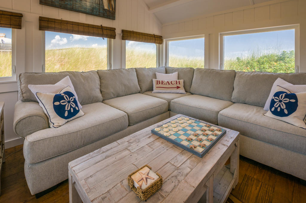 217 Phillips Road Sandwich, MA 02562 - Photo 7 of 37 a living room with furniture and a large window