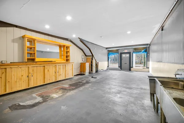a view of an entryway door and an empty room