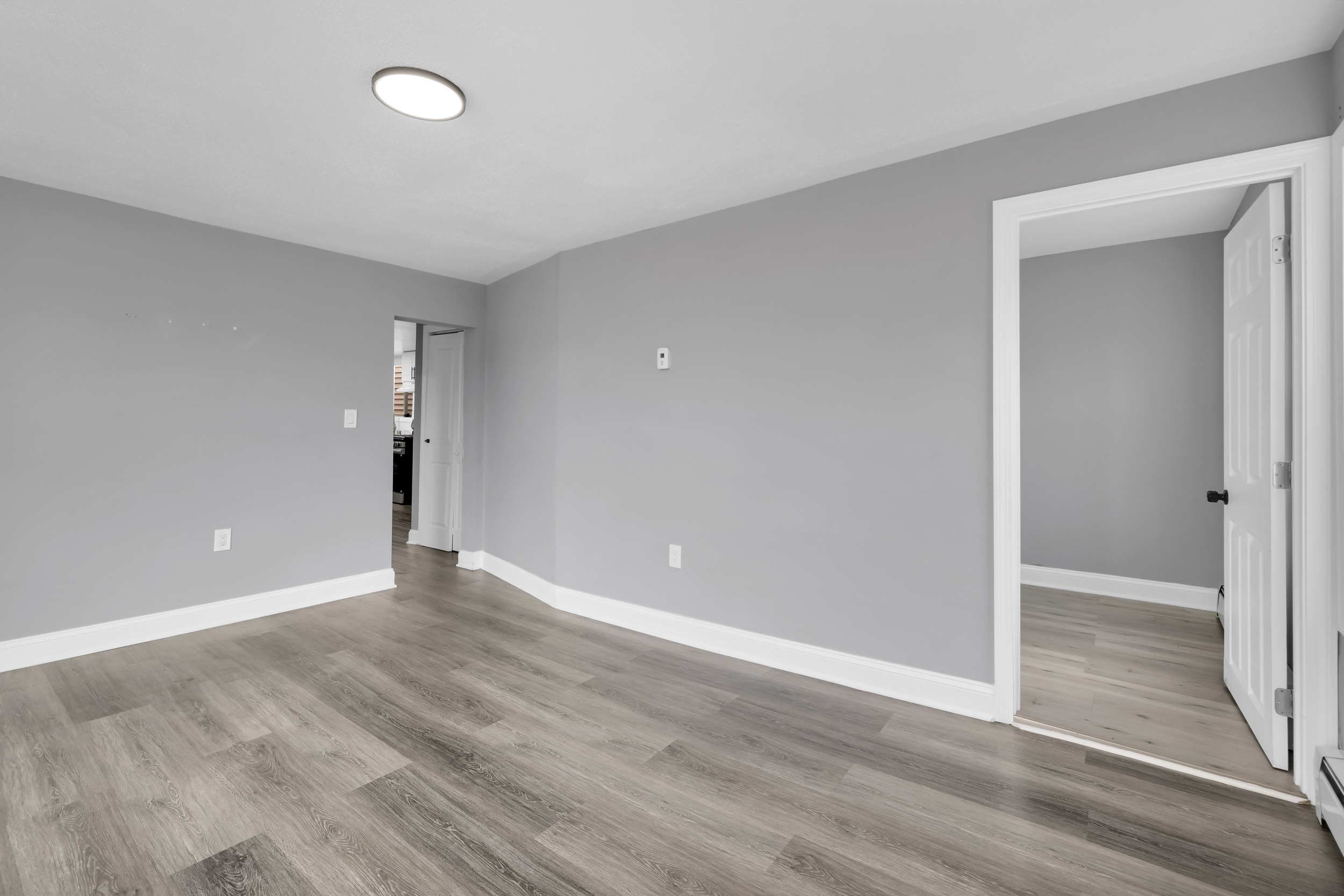 720 Main Street Winchester, CT 06098 - Photo 18 of 38 a view of an empty room with wooden floor