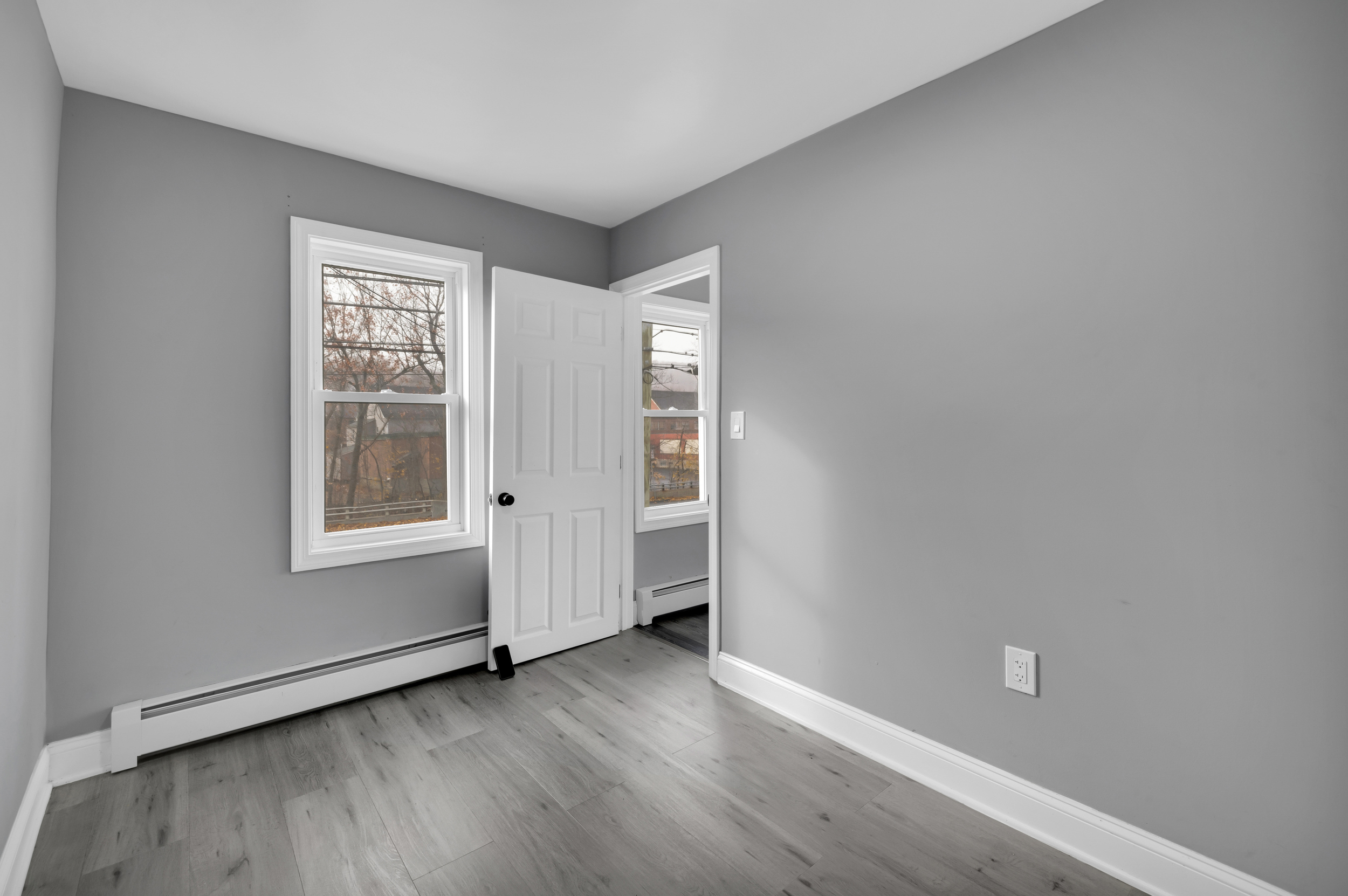720 Main Street Winchester, CT 06098 - Photo 20 of 38 a view of an empty room with wooden floor and a window