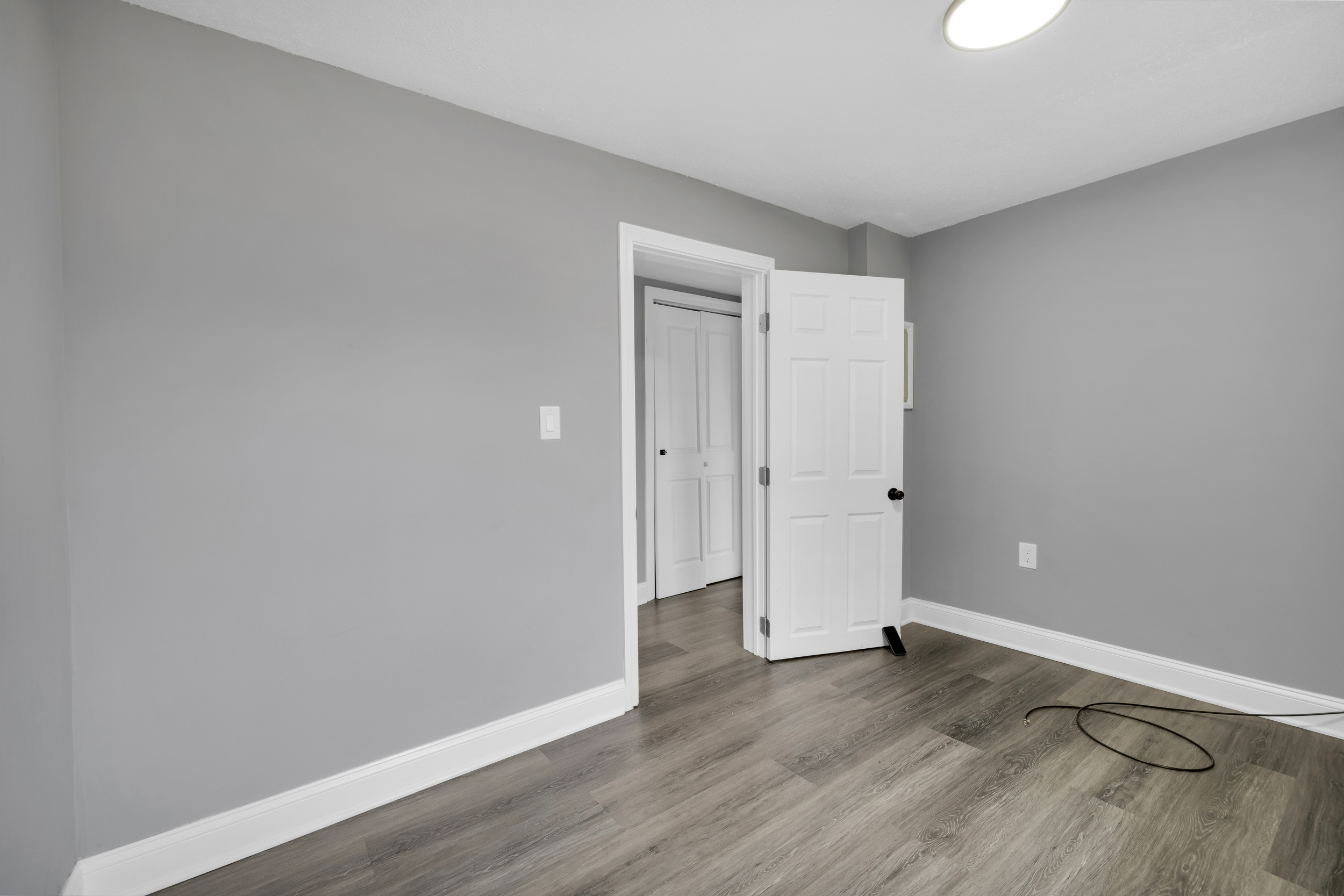 720 Main Street Winchester, CT 06098 - Photo 22 of 38 a view of an empty room with wooden floor